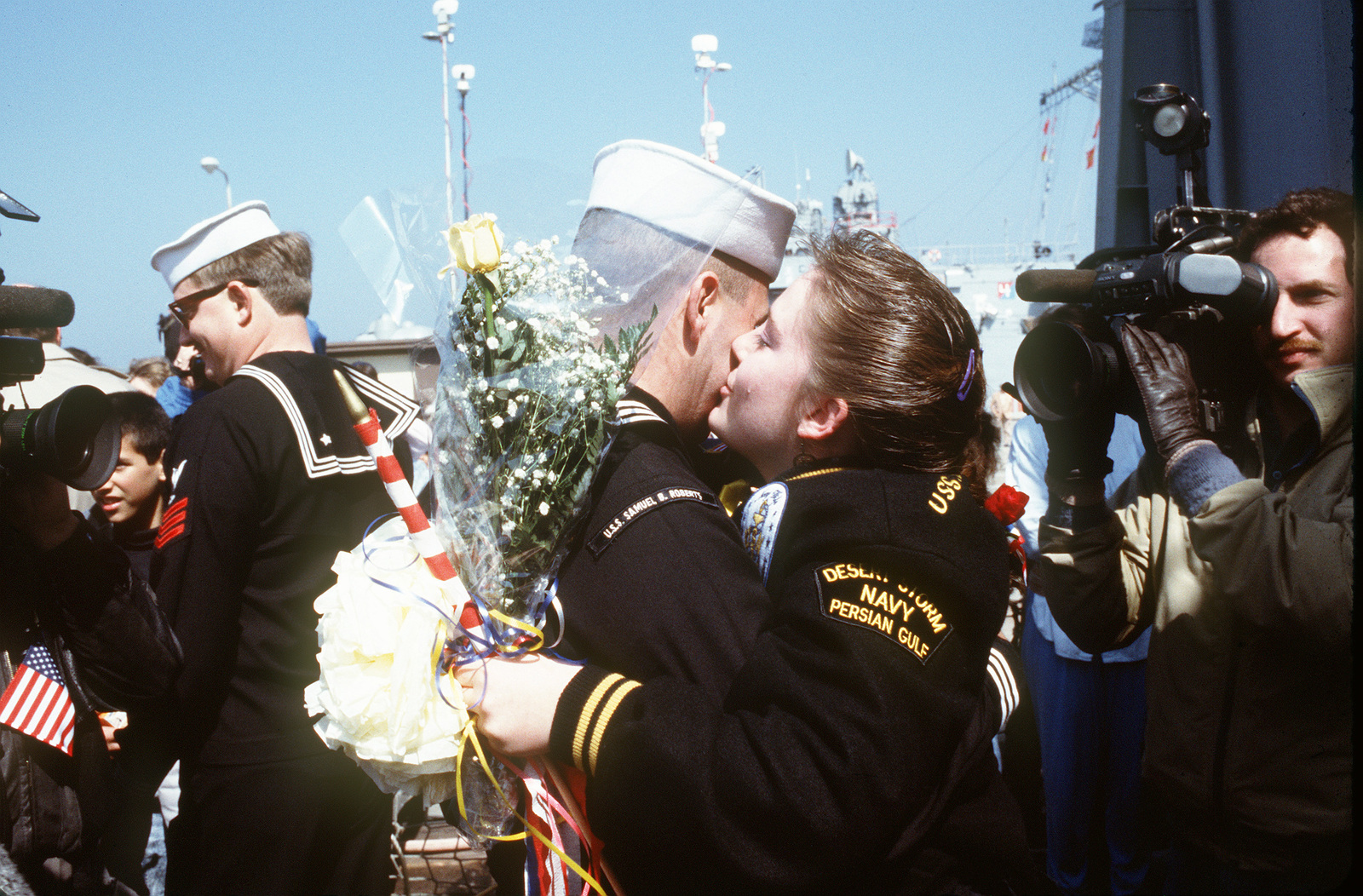 a sailor from the guided missile frigate uss samuel b roberts ffg 58 embraces d5a305 1600