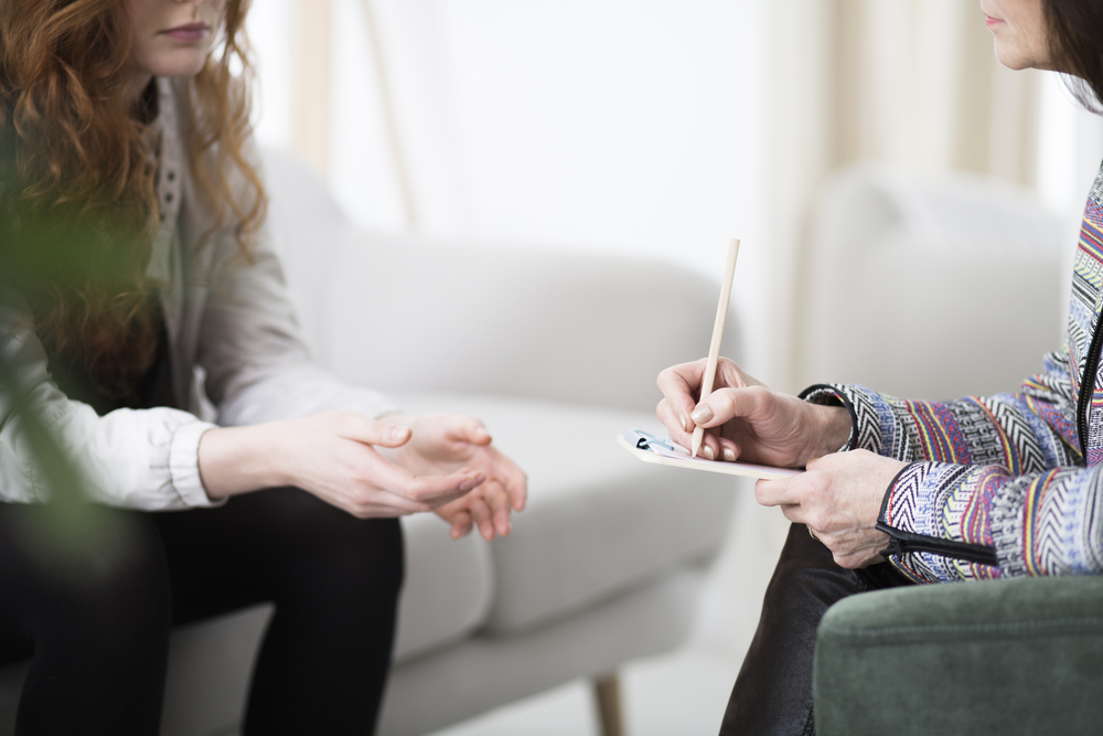 A woman in a cognitive behavior therapy (cbt) session at Transformations at Mending Fences in Morriston, FL, for her mental health condition to learn healthy coping mechanisms