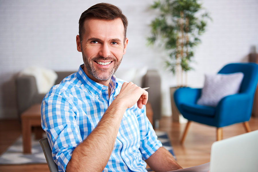 A man happy after working with EFT therapists at Transformations at Mending Fences, a leading mental health center that uses EFT and attachment theory to help clients break free from negative patterns of behavior