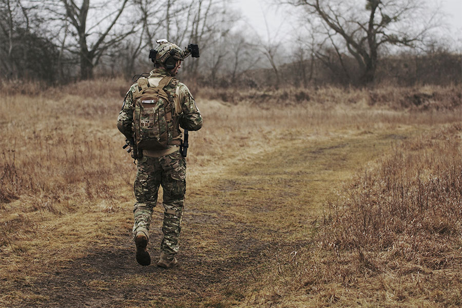 Soldier walking in the woods