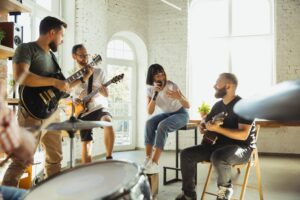 A music therapy session at Transformations Mending Fences, with patients and therapists using musical instruments for emotional expression and healing.