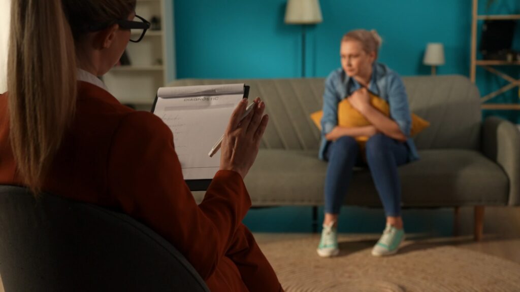 A young woman and a therapist during an ART session working on how to process traumatic memories and reduce the symptoms of posttraumatic stress disorder