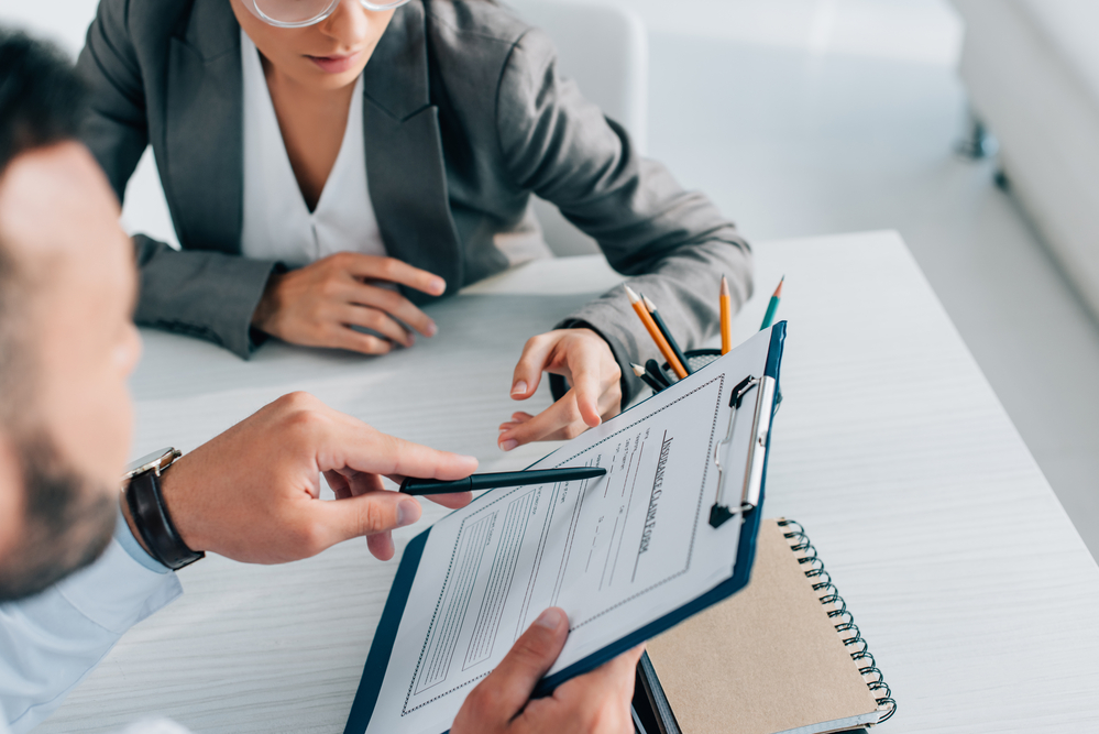 A person looking at their Aetna plans for covered services and intensive outpatient treatment to treat alcohol abuse, drug addiction and mental health treatment