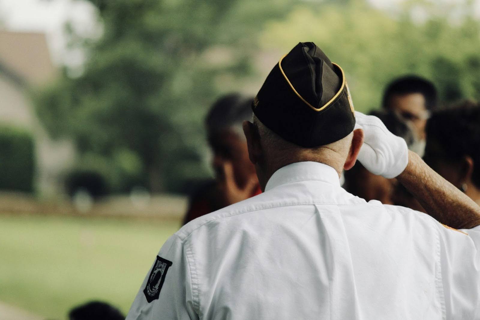 veteran with PTSD saluting a fallen comrade, a concept image for how there are certain myths and facts about PTSD